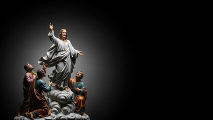 Jesus Christ ascension statue with disciples looking up. Religious Christian art on a dark background. Spiritual biblical event representation