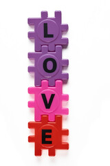 Concept of building relationships: intertwined toy letters.