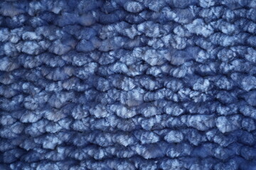 Blue fleece fabric texture background Close-up texture of soft blue fleece fabric. Abstract textile background with fluffy material and cozy fabric surface. © Анна Климчук