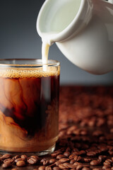 Cream is added to the coffee.