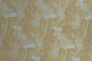 Obraz premium Mustard yellow and beige woven textile background with distressed abstract print