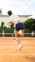 Girls participate in final tennis match, students of sports school practice skills and mastery during doubles tennis tournament.