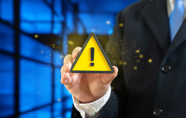 Businessman and warning sign. Warnings for businesses and entrepreneurs. New rules and laws, taxes....