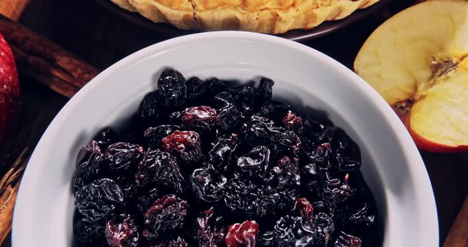 Overhead view, tour view of apple pie with ingredients, on a natural surface.