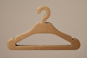 Floating eco friendly clothes hanger made from layered recycled cardboard