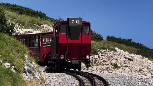 Red Cogwheel Mountain Train Climbing Steep Slope