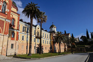 Naklejka premium New Athos Monastery buildings on a sunny day in Abkhazia.