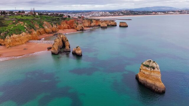 Aerial Establishing Shot of Rocky Coastline and Cliffs in Lagos Algarve Portugal