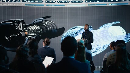 African american speaker does futuristic industrial presentation with a turbine, panel discussion...