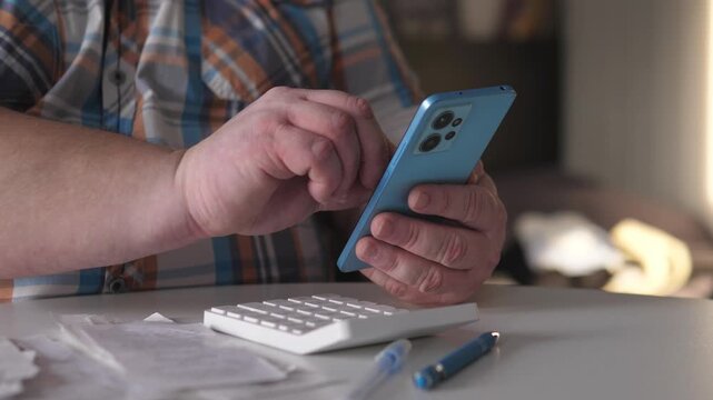 Man Manages Finances, Man Handles Digital Money Transfer, Male Individual Executes Online Financial Transaction Successfully, Man In Plaid Shirt Completes Electronic Payment With Proof