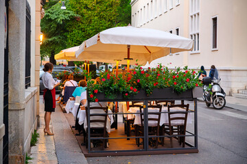  Female Server Stands Alongside