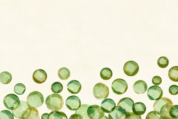 Green gemstones arranged in abstract sparkling pattern on light neutral background creating decorative and colorful border for elegant jewelry design or luxury ornament projects.