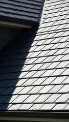 Detailed View Of Gray Slate Roof Tiles With Dramatic Shadow Contrast