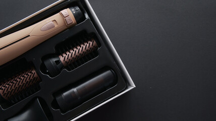 New hair styling tool set with attachments in a box, ready for use