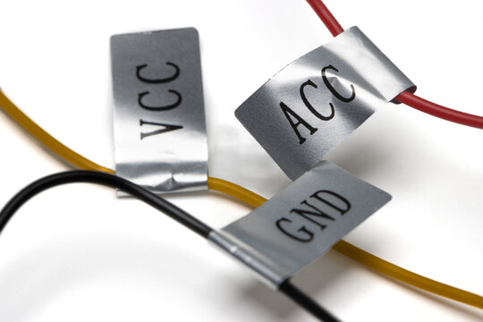 labels on automotive wiring harness, showing ACC for Accessory Power, GND for Ground and VCC for Constant Power.
