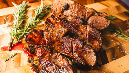 Sliced boneless lamb leg arranged on a wooden board, crispy outside and juicy inside. Beautifully presented, tender, and ready to serve for gatherings and special meals.
