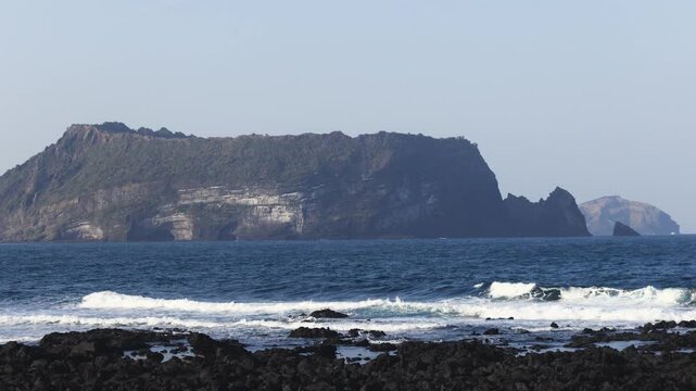 Jeju-do, Seongsan Ilchulbong  landscape, volcanic tuff cone, Sunrise peak, Jeju Island, South Korea, Seongsan-ri, Seogwipo, Jeju Province landscape view in a sunny day, with sea, cliffs hiking trail