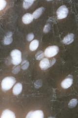 texture background of cracked white wax paper with atmospheric lights and shadows