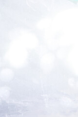 texture background of cracked white wax paper with atmospheric lights and shadows