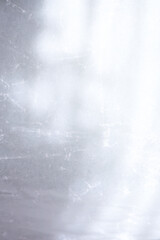 texture background of cracked white wax paper with atmospheric lights and shadows