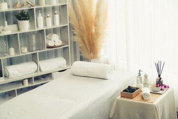 Naklejka premium Exquisite display of beauty treatment and spa salon accessories arranged on spa table in luxury spa resort. Relaxing spa massage and recreation background concept. Quiescent
