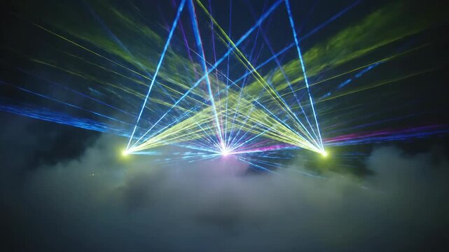 Bright beams of colored light spread upwards from three points amidst a foggy, dark background