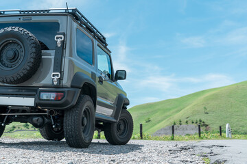 Driving spot, car parked on the plateau of the driving route