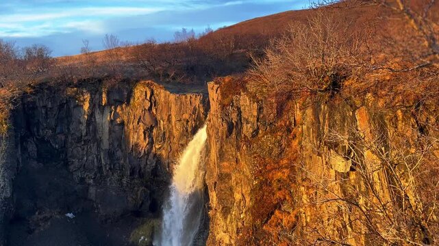 Wide Static Shot of Hundafoss Waterfall at Sunset, Iceland.