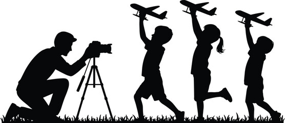 Silhouette of photographer filming children playing with toy airplanes, capturing childhood imagination, creativity, teamwork, and dreams against white background for family,