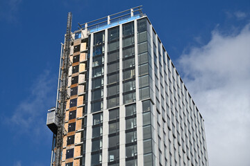 Fototapeta premium Construction site with the elevator in action