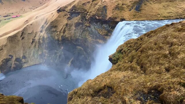 Wide Angle Top View of Skogafoss Waterfall and Plunge Pool, Iceland.