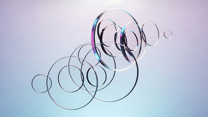 Abstract metallic rings floating on gradient background