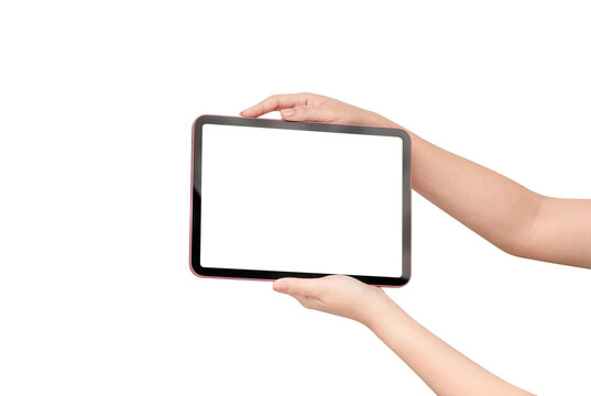 Close up of hands holding a pink digital tablet in horizontal orientation and using a stylus pen on blank white screen isolated on white background. Concept for online learning, digital drawing, and c