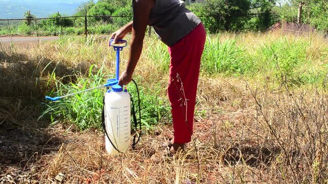Woman Pumping Air In A Spray Bottle