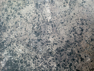 Weathered Concrete Surface with Dark Spots