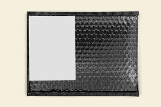 Shipping label mockup png transparent, black bubble mailer bag