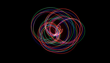 Dynamic abstract light trails creating vibrant circular patterns and energetic swirls against a deep black backdrop, showcasing modern artistic light painting
