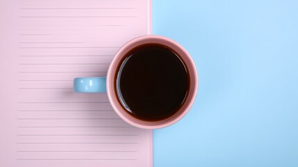 Open Notebook with Coffee and Pen on a Two Tone Background