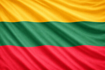 Obraz premium Waving Lithuania Flag Horizontal Background with Yellow Green Red Fabric Texture