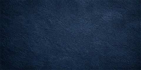 A closeup of a dark blue leather texture background featuring a rough textured pattern that blends a denim fabric aesthetic with a high-fashion material surface for a versatile wallpaper backdrop © fart and poop