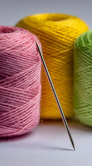 dise&ntilde;o de un fondo con madejas de colores de hilos coloridos con una aguja filosa carretes de hilo para coser o tejer