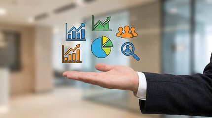 Professional hand presents diverse business data and analytics icons for growth strategy in a corporate setting