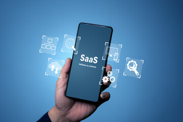 SaaS software as a service on smartphone with cloud computing and automation icons