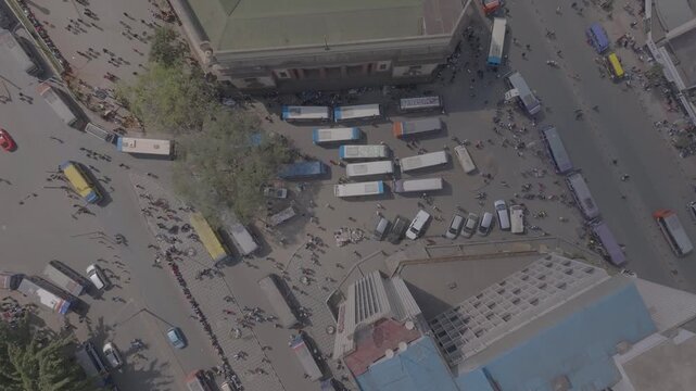 An aerial view of Nairobi city streets with people and Matatu buses