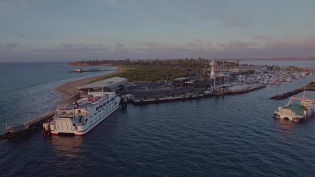 Rising aerial Queenscliff harbour, revealing the town, sunrise, Australia