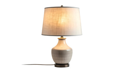 A ceramic table lamp with a white lampshade on a black background