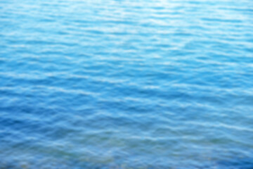 Fototapeta premium Calm blue sea water. Blurred background. Space for text.