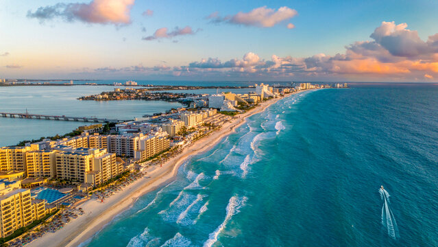 Breathtaking Aerial View of Turquoise Ocean Waves Crashing Along the Pristine Sandy Beaches of Cancun Hotel Zone, Mexico in a Vibrant Summer Paradise