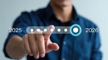 Persons hand touching futuristic digital interface indicating a progression from year 2025 to year 2026 showing future planning an