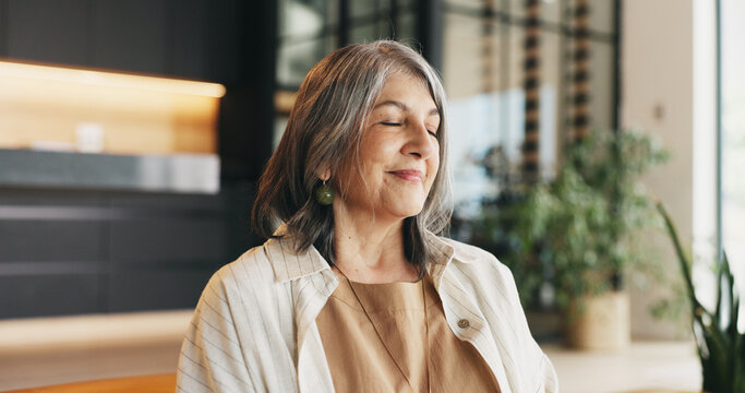 Happy woman, relax and peace in home with meditation, spiritual awareness or stress relief for wellness. Zen, mature person and calm in house with mindfulness, holistic health and practice gratitude.